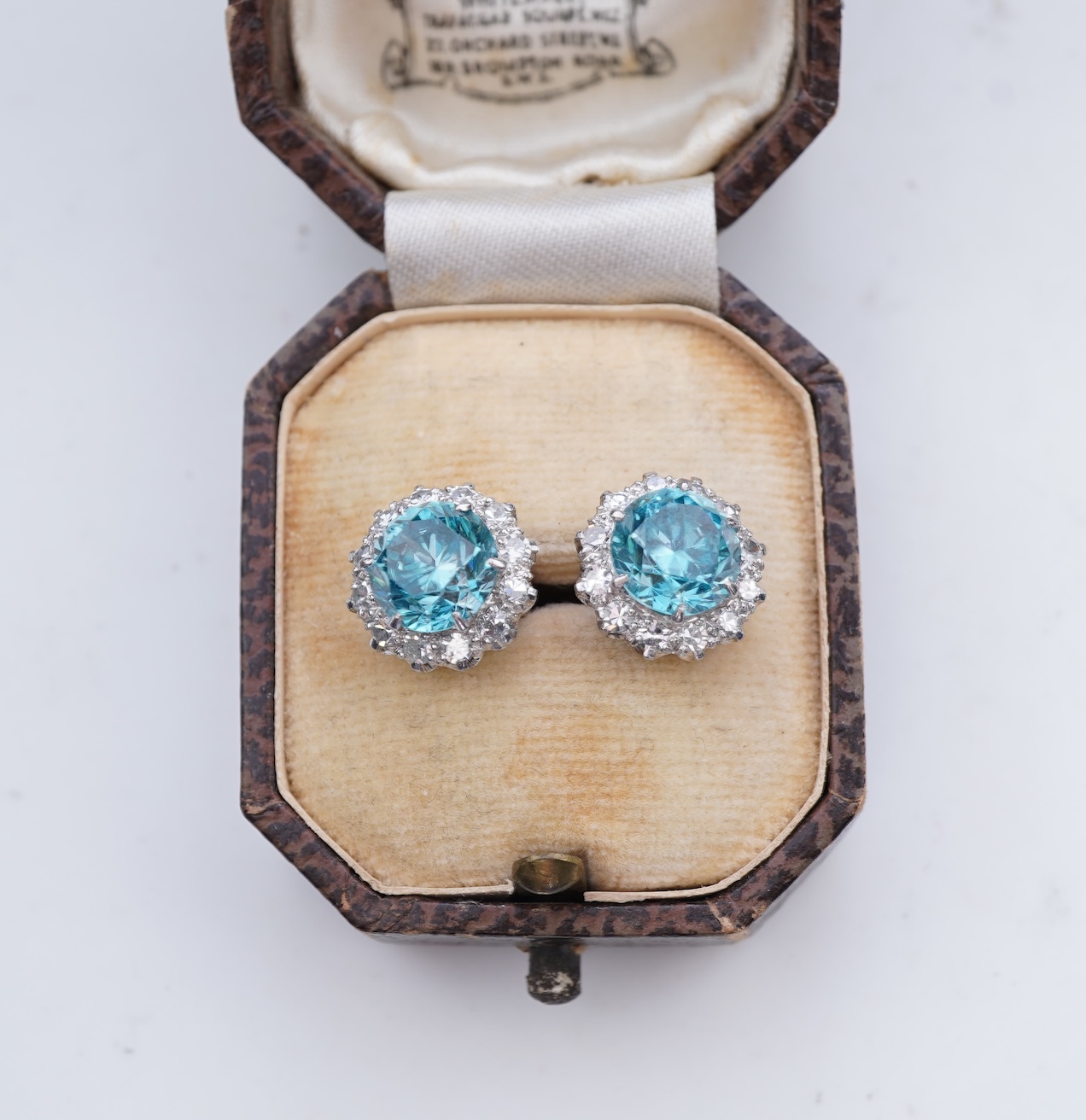 A pair of zircon and diamond earrings, mid 20th century